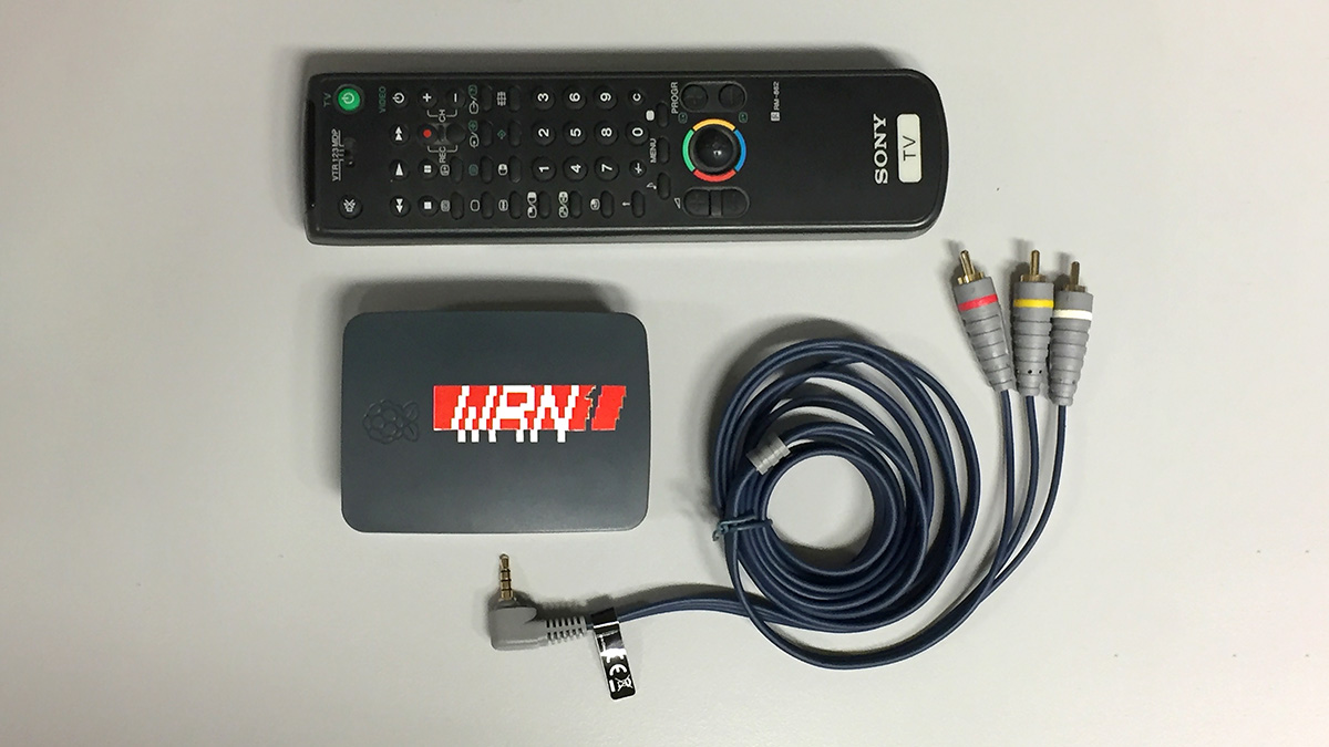 An old Sony TV remote, a Raspberry Pi in a case with WRN1 on it, and a composite video cable.